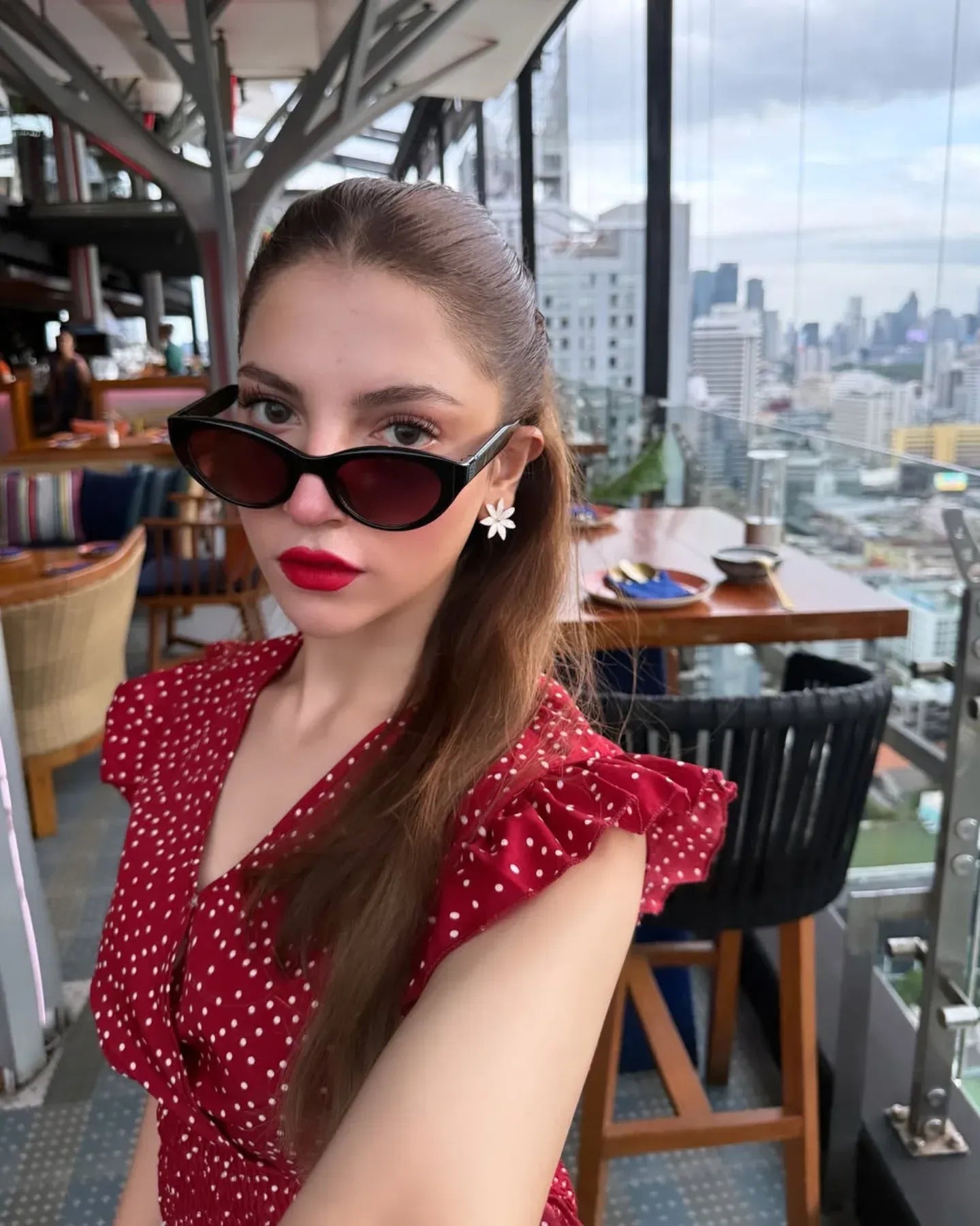 Dananeer, polka dot ruffle top, shirred knotted blouse, cute crop top women, trendy polka dot shirt Pakistan, flirty chic blouse, breezaya polka dot top, ruffle trim blouse, casual cute top women, knotted summer blouse, fashionable tops 2025, retro style polka dot shirt